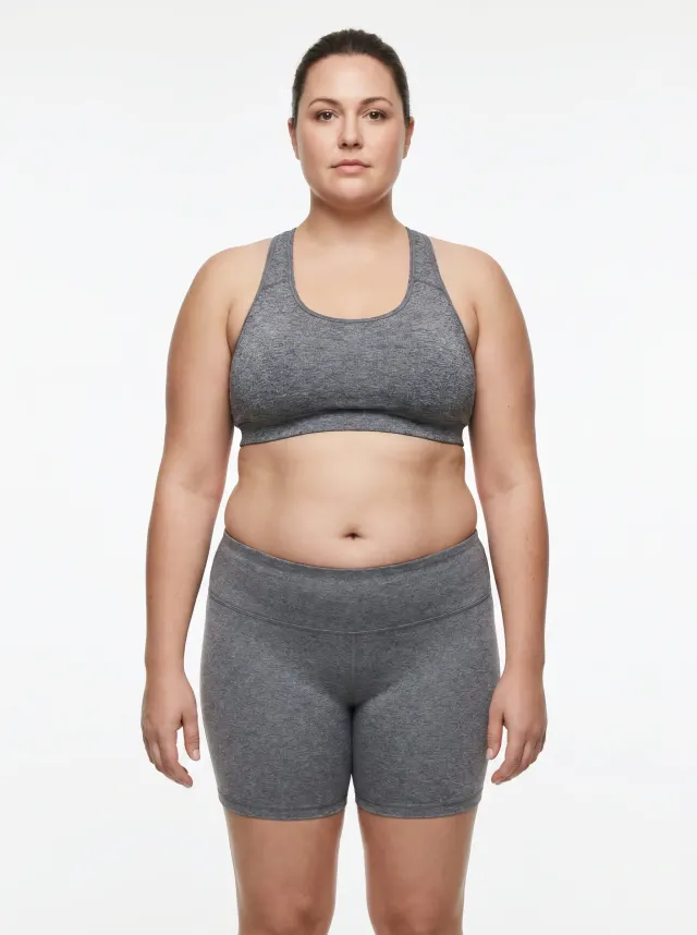 42 percent body fat woman — standardized reference photo showing significant fat accumulation through the midsection, hips, and limbs