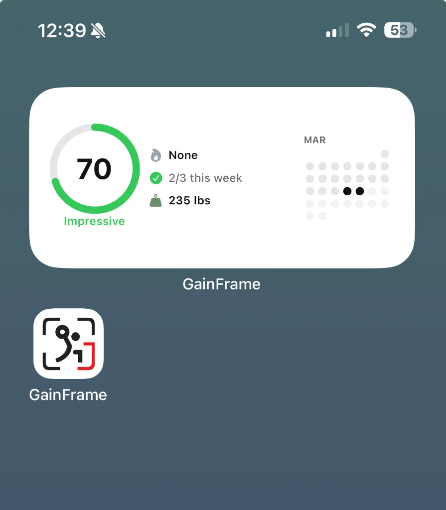 GainFrame medium widget on iPhone home screen showing AI Physique Score, check-in streak, weight, and monthly calendar dot grid